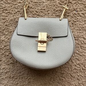 Chic Gray Crossbody Bag with Gold Accents